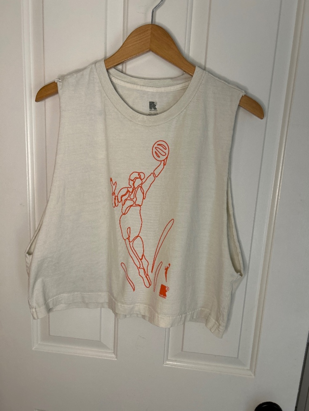 Round21 x WNBA Fire Strength Tank Top featuring an orange line-art graphic